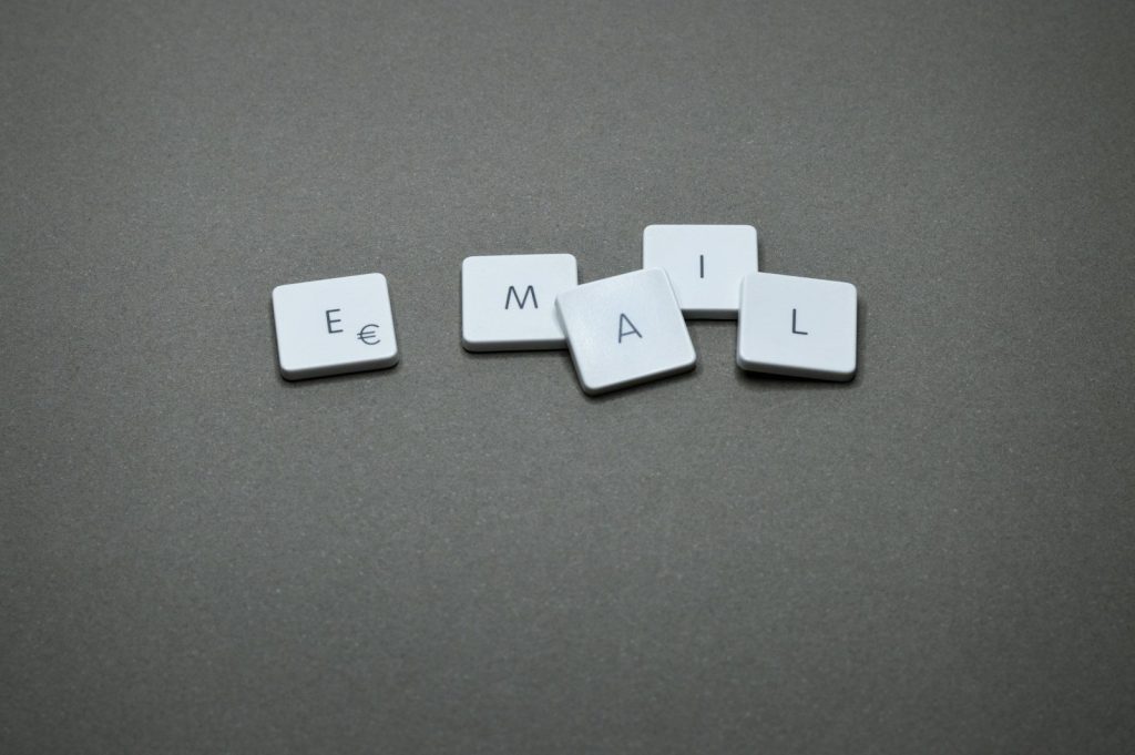 The word "email" is spelled out with letter tiles.
